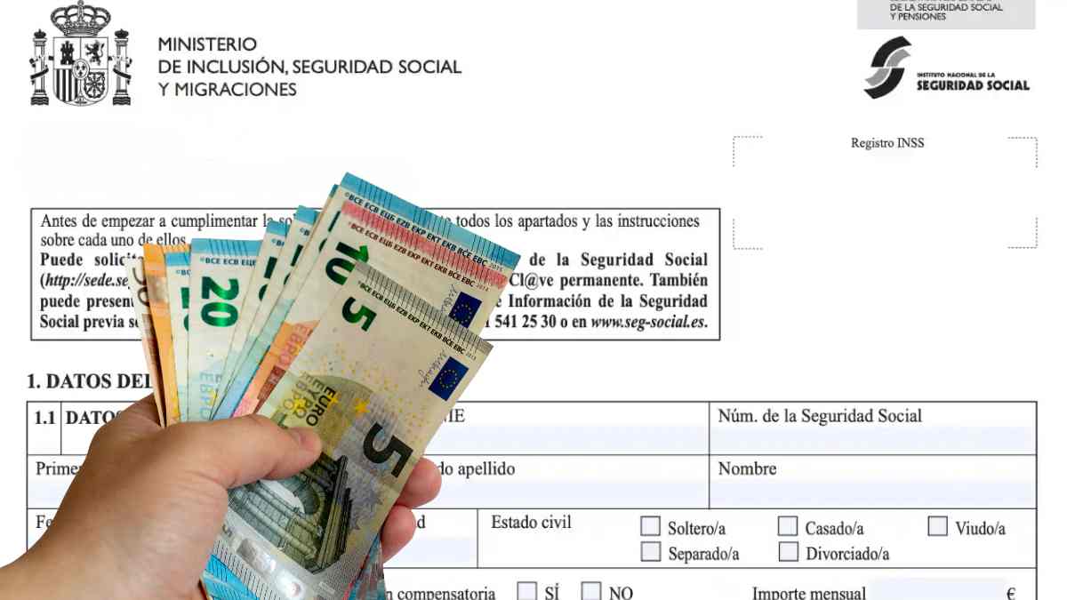 Mano sostiene billetes de euro sobre el formulario del Ingreso Mínimo Vital 2025.