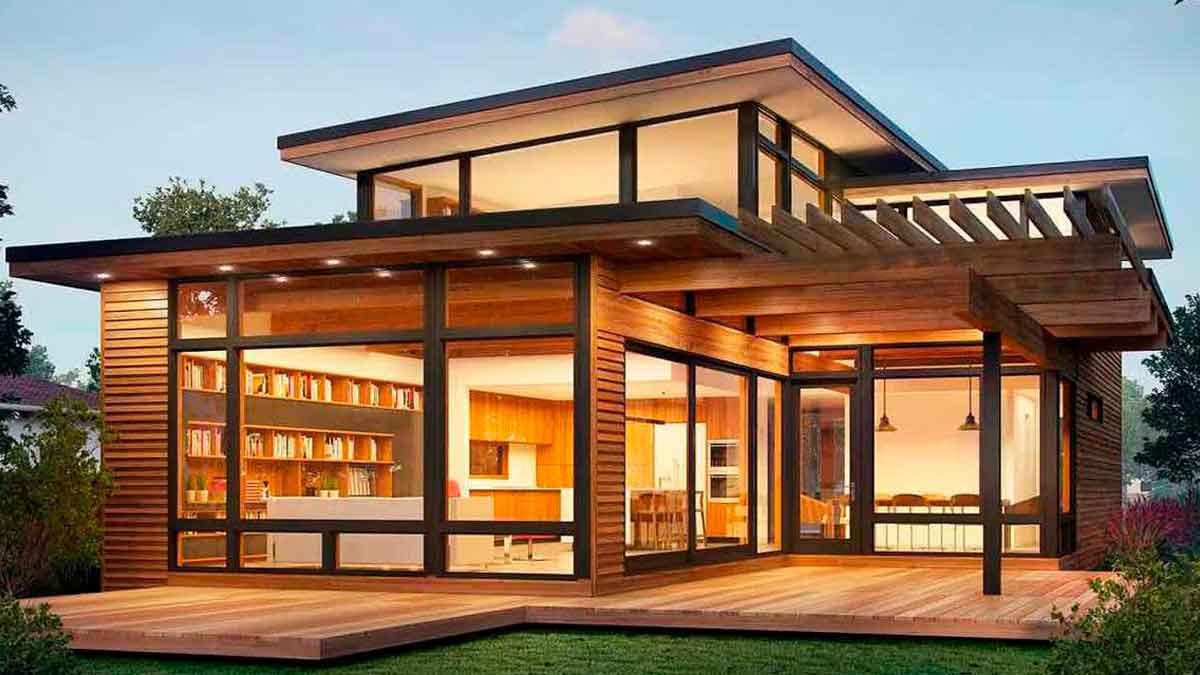 Minicasa de lujo prefabricada con dos plantas, gran terraza y fachada de madera con amplios ventanales iluminados